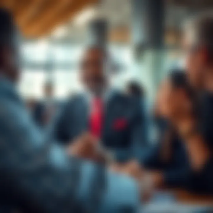 Collaborative Successes of Jabulani Ngcobo in His Career Jabulani Ngcobo engaging in a discussion with colleagues, highlighting his professional achievements and collaborative spirit