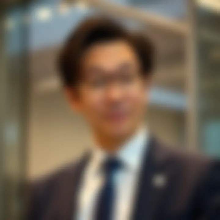 Takashi Kotegawa in Professional Setting Portrait of Takashi Kotegawa in professional attire with a focused expression